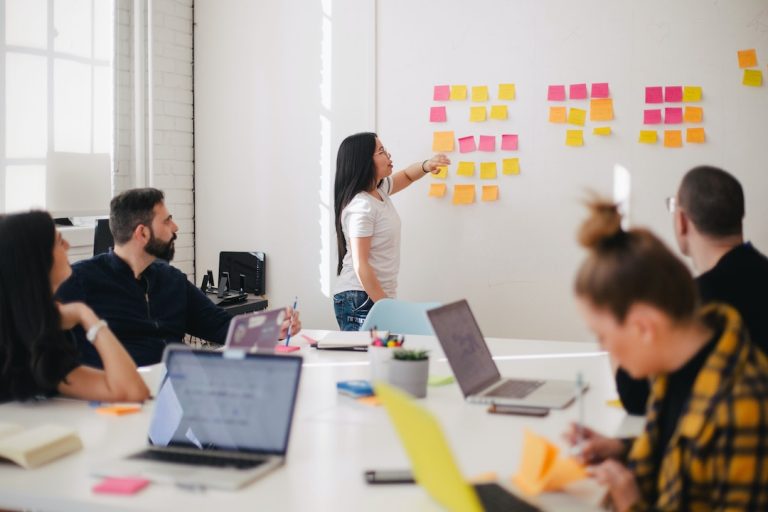 A marketing leader discussing bottom of the funnel marketing strategies with a team